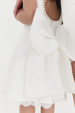 Girls pearl trimmed bow back mini dress