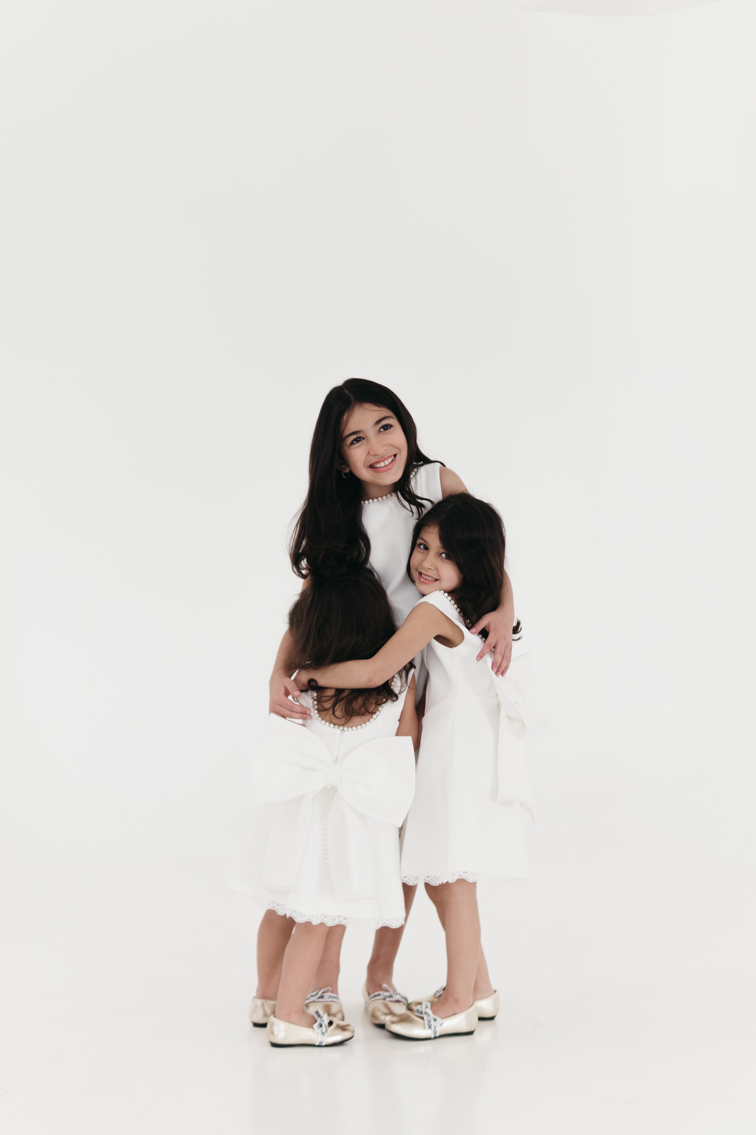 Girls pearl trimmed bow back mini dress