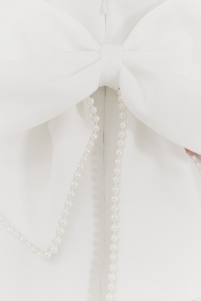 Girls pearl trimmed bow back mini dress