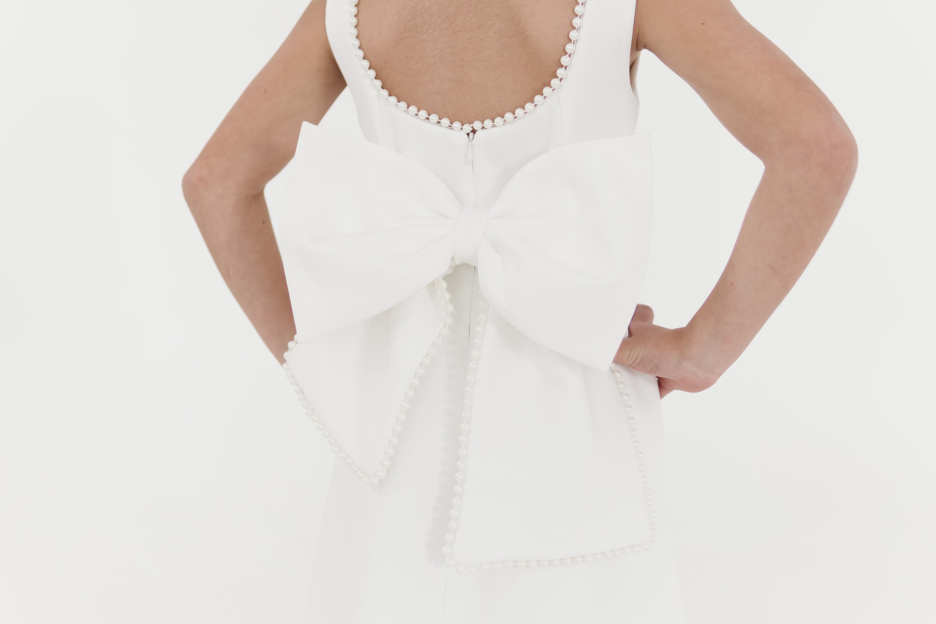 Girls pearl trimmed bow back mini dress