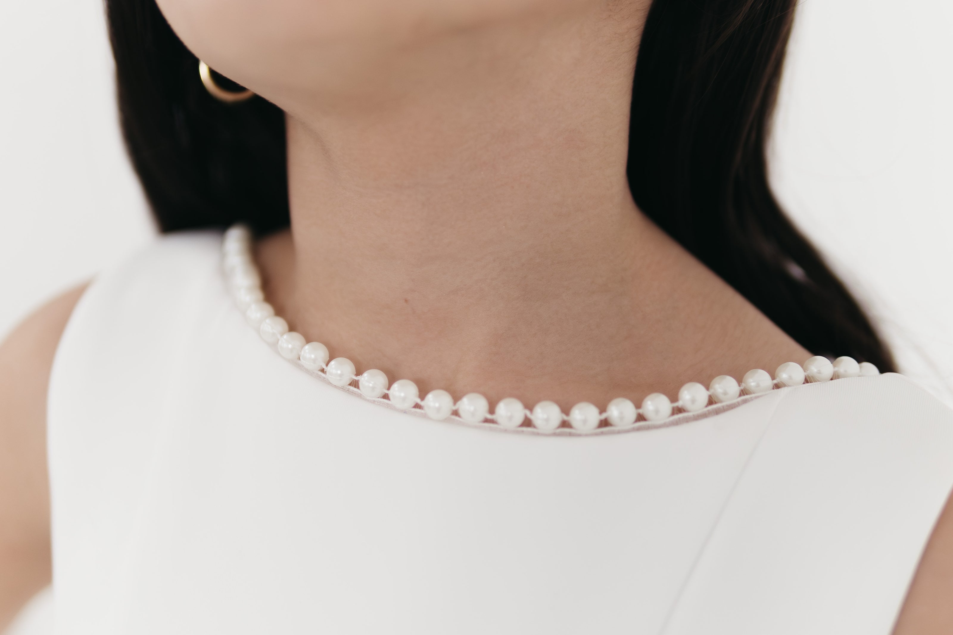 Girls pearl trimmed bow back mini dress