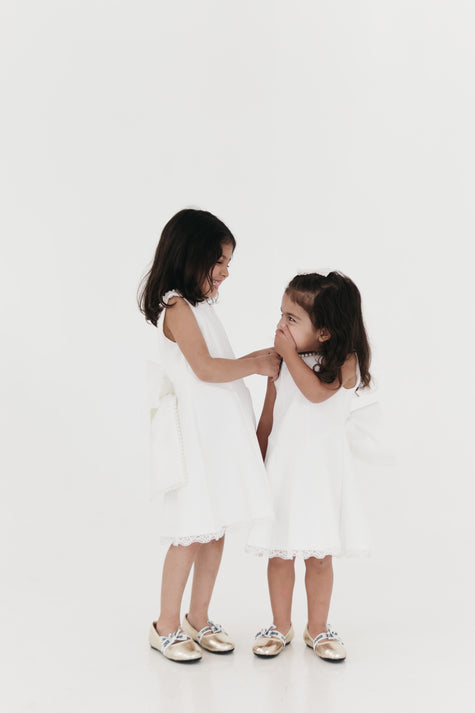 Girls pearl trimmed bow back mini dress