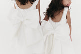 Girls pearl trimmed bow back mini dress