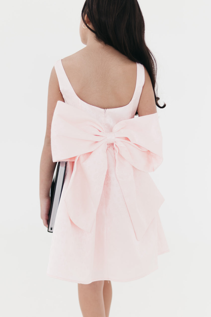 Girls bow back perfect in pink mini dress