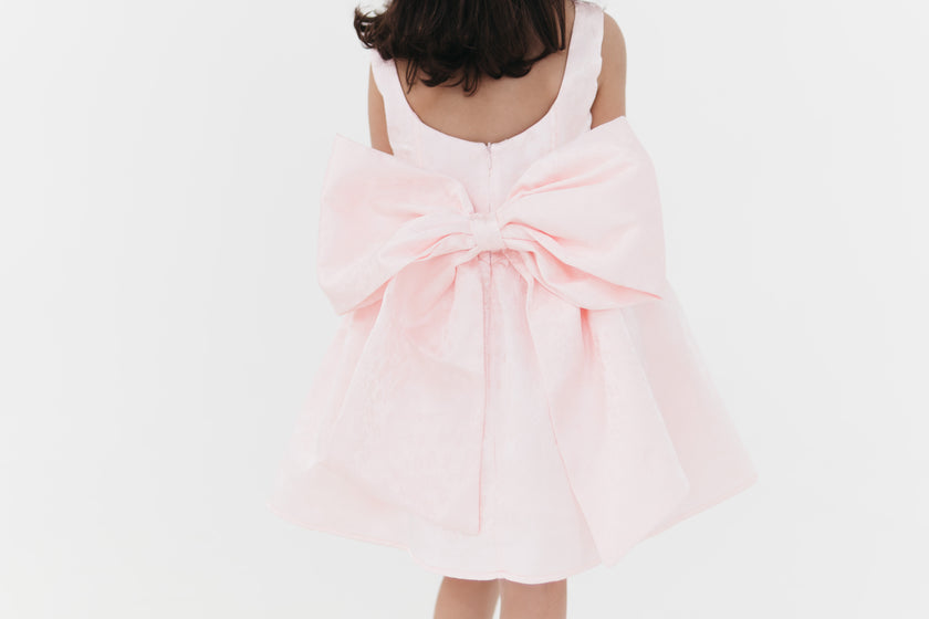 Girls bow back perfect in pink mini dress