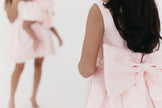 Girls bow back perfect in pink mini dress