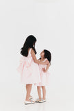 Girls bow back perfect in pink mini dress