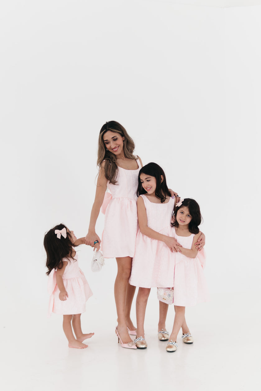 Girls bow back perfect in pink mini dress