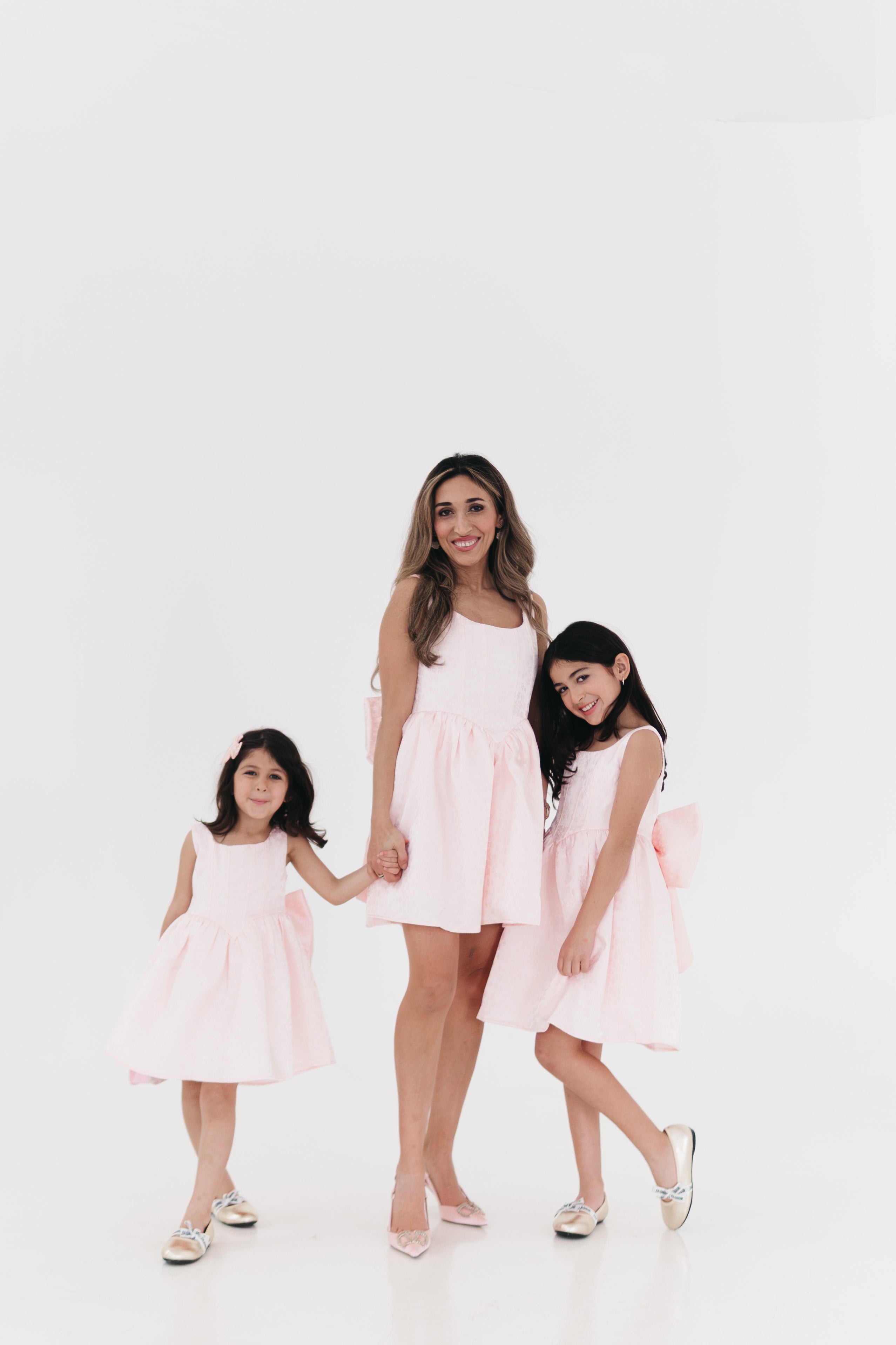 Girls bow back perfect in pink mini dress