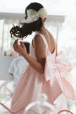 Girls bow back perfect in pink mini dress