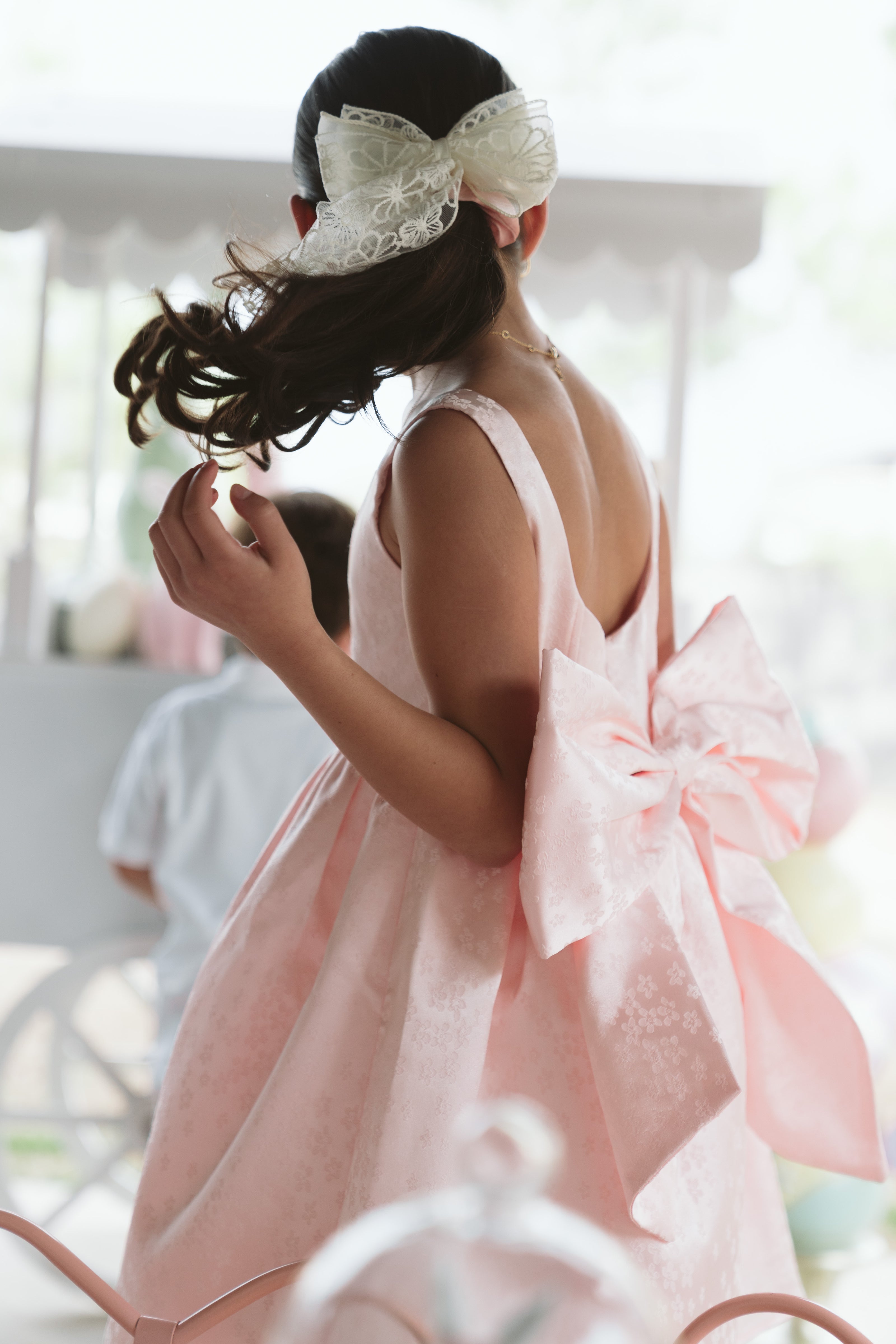 Girls bow back perfect in pink mini dress